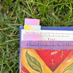 The gradient bookmarks sitting different ways in a few books.