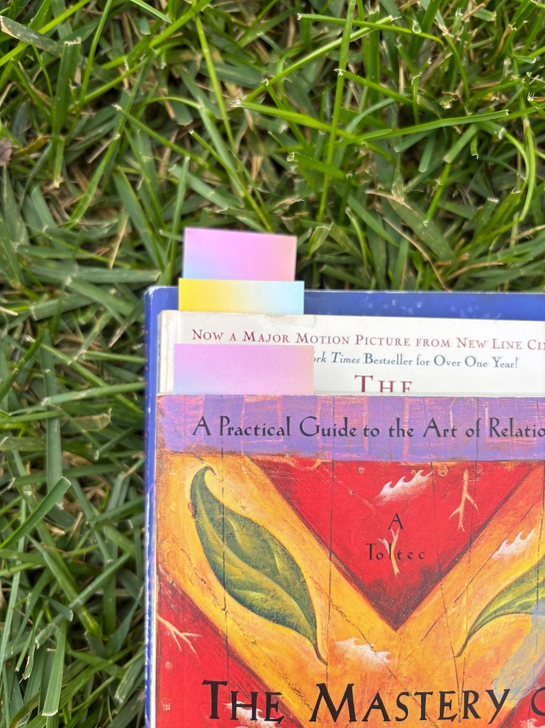 The gradient bookmarks sitting different ways in a few books.
