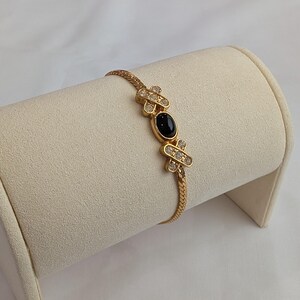 Vintage AVON "Hugs and Kisses" Gold Tone Rhinestone Black Cabochan Bracelet, 6.75"