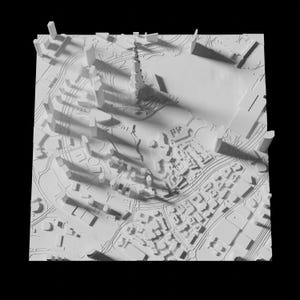 Puede incluir: Un modelo 3D blanco de un horizonte de ciudad con edificios altos y un gran parque en el centro.