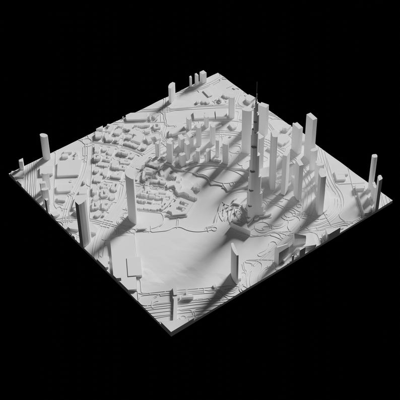 Puede incluir: Un modelo 3D blanco de un horizonte de ciudad con edificios altos y una gran torre central. El modelo est&aacute; sobre un fondo negro.