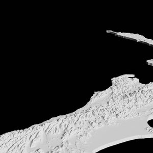 May include: A 3D printed model of a coastline with a detailed, textured surface. The model is white and appears to be made of plastic.