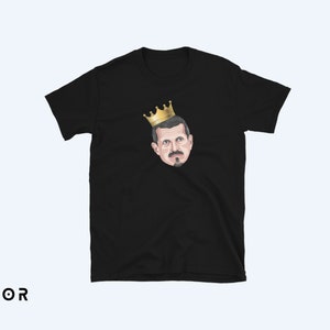 May include: Black t-shirt with a cartoon illustration of a man wearing a gold crown.