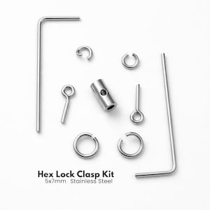 May include: A stainless steel Hex Lock Clasp Kit, including various components like rings, pins, and a barrel-shaped piece. The kit is 5x7mm in size and is designed for jewelry making or similar crafts. The components are arranged on a white background.