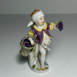 RARE Antique MEiSSEN Small Porcelain Figurine &#39;Angel Cherub with Grapes&#39;, Meissen Autumn Allegory  Figurine First Sorting. Crossed Swords