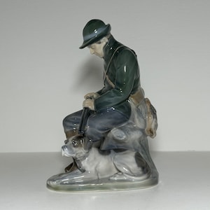 RC Royal Copenhagen Dinamarca Estatueta Caçador com Cachorro #1087 Projetado por Christian Thomsen 22 cm Primeira triagem