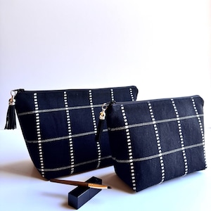 Black woven makeup bag with white stitching square design, black woven zippered pouch; black everyday storage pouch; multipurpose pouch