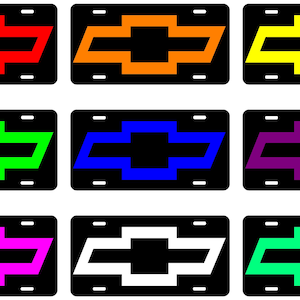May include: Nine different colored license plate frames with a black background and a white outline. The frames feature a Chevrolet bowtie logo in the center. The colors are red, orange, yellow, green, blue, purple, pink, white, and light green.