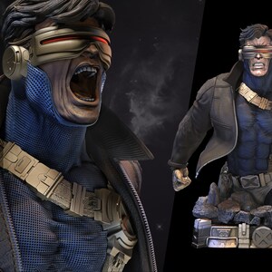 May include: A bust of Cyclops from the X-Men, wearing a blue and black costume with a brown leather jacket. The bust is posed with his mouth open and his eyes closed, as if he is using his optic blasts. The bust is on a rocky base with the words "Wicked" and "patreon.com/wicked" printed on it.