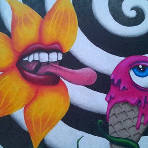 May include: A yellow flower with a red mouth and a pink tongue is licking a pink ice cream cone with a blue eye. The background is a black and white spiral.