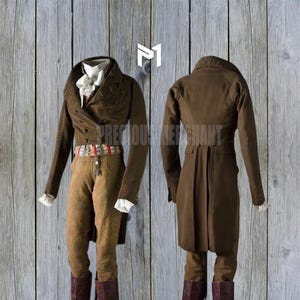 May include: A brown tailcoat with a high collar and a long, flowing back. The coat has a double-breasted closure and is decorated with a white cravat. The coat is worn over a pair of brown trousers and a white shirt.