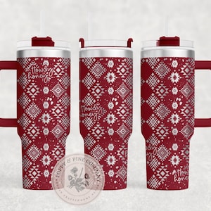 May include: A red and silver stainless steel tumbler with a handle and a straw. The tumbler features a geometric pattern and the text "Howdy Honey" on it.
