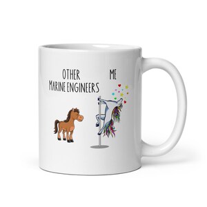 May include: White ceramic mug with the text "OTHER MARINE ENGINEERS ME" and illustrations of a brown horse and a unicorn. The unicorn is pole dancing. The mug has a white handle.