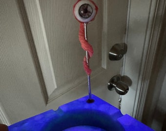 Glowing ashtray with eyeball