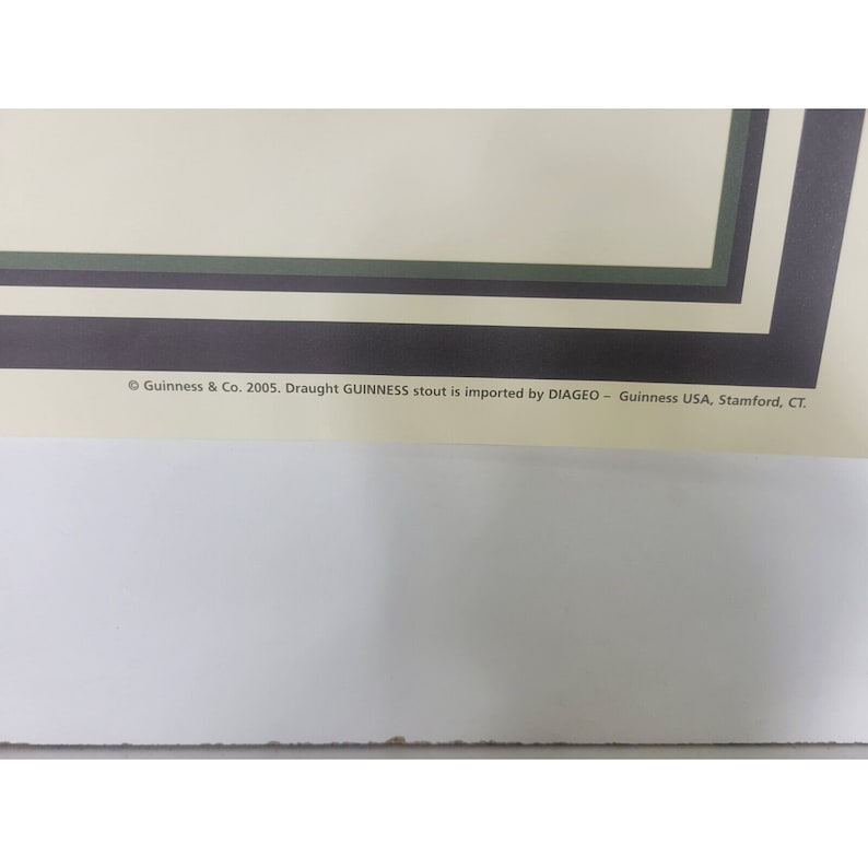 May include: A close-up of the bottom of a poster with the text "Guinness & Co. 2005. Draught GUINNESS stout is imported by DIAGEO - Guinness USA, Stamford, CT."