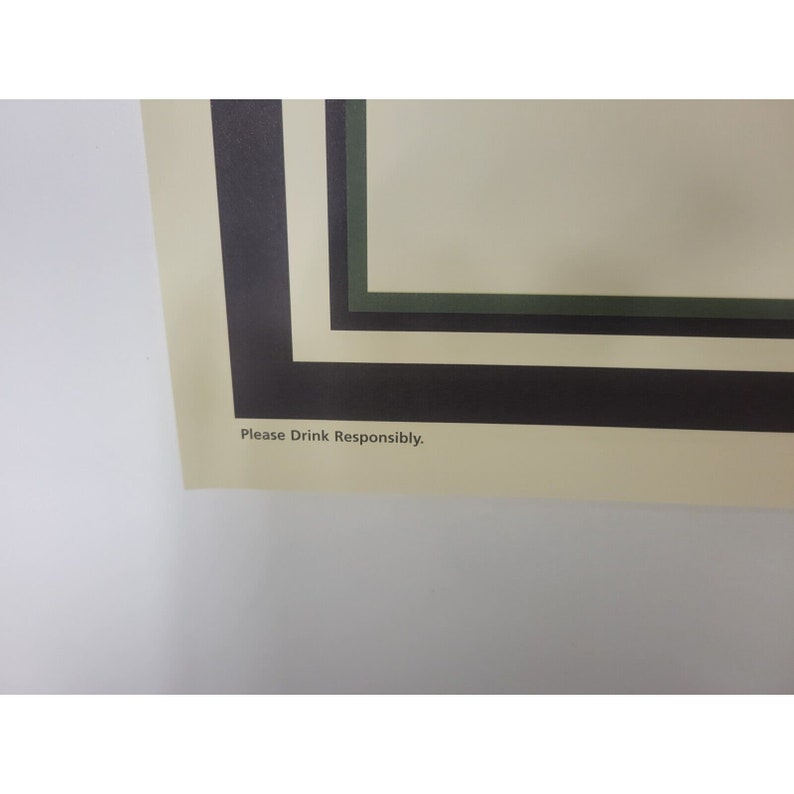 May include: A close-up of a poster with a black, white, and green border. The text "Please Drink Responsibly" is printed at the bottom of the poster.