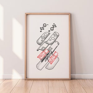 May include: A framed illustration of a disassembled video game controller. The illustration is in black and white, with the exception of the red and white buttons. The controller is shown in various pieces, including the buttons, the joystick, and the shell.