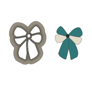 May include: An image features a bow-shaped cookie cutter next to a teal and cream-colored bow illustration. The cookie cutter is gray and has a detailed outline. The bow illustration has teal-colored loops and cream-colored center.