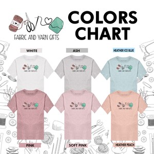 May include: Color chart showing ten different t-shirt colors for a fabric and yarn gifts shop. The colors are white, ash, heather ice blue, pink, soft pink, and heather peach. Each color has a t-shirt with a logo of a needle, thread, and yarn ball.
