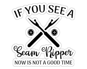May include: Black and white sticker with a seam ripper and buttons, and the text "If you see a seam ripper now is not a good time."