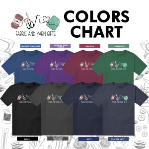 May include: A color chart showing different t-shirt colors available for purchase. The t-shirts feature a graphic of a spool of thread, scissors, and a heart with the text "Fabric and Yarn Gifts". The colors shown are Heather True Royal, Heather Team Purple, Maroon, Evergreen, Black, Dark Grey Heather, Navy, and Heather Navy.