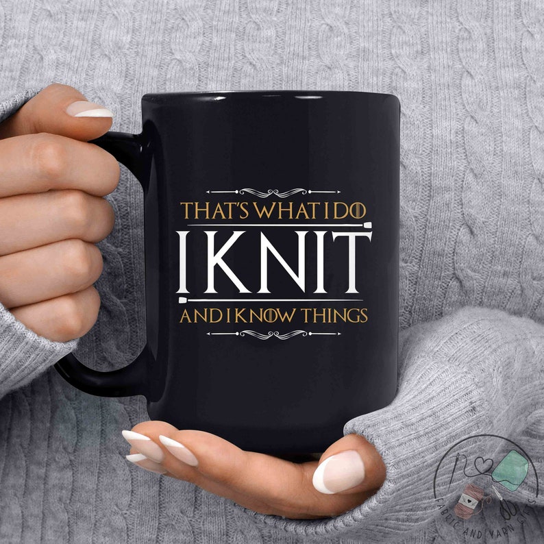 May include: Black coffee mug with a white design that says "That's what I do I Knit and I know things".