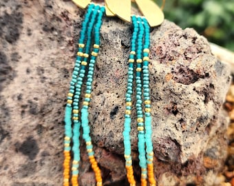 Teal tassel earrings on Brass