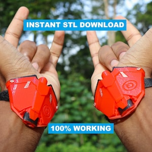 Può includere: Una coppia di dispositivi rossi stampati in 3D montati al polso con cinturini neri. I dispositivi hanno un pulsante circolare e un piccolo ugello. Il testo "INSTANT STL DOWNLOAD" e "100% WORKING" è visibile nell'immagine.