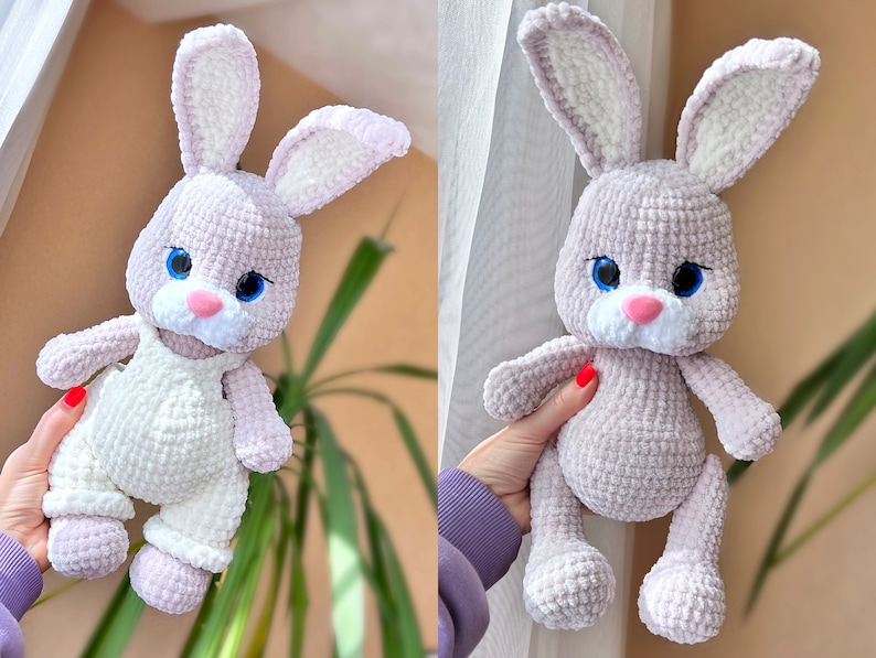 May include: A crocheted plush bunny toy with long ears, a pink nose, and blue eyes. The bunny is wearing a white crocheted outfit with straps.