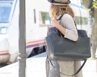 Luxurious gray water-repellent canvas travel luggage with extensive storage .
