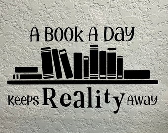 Un libro al giorno tiene lontana la realtà - Adesivo in vinile