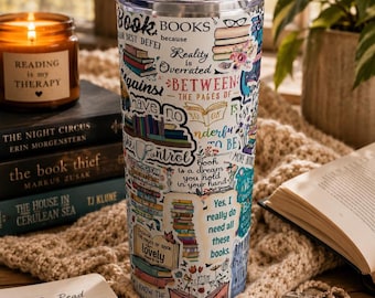May include: A stainless steel tumbler covered in book-themed stickers and quotes. The tumbler features stacks of books, floral accents, and phrases like "Reading is my therapy." A candle and books are in the background.