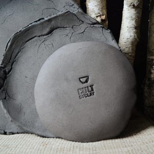 May include: Two gray ceramic plates, one on top of the other, with a smaller gray ceramic bowl on top. The bowl has the text "Cult of Clay" stamped on the bottom.