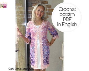 May include: A woman wearing a crocheted cardigan in shades of pink and purple. The cardigan has a delicate floral pattern and is shown in front of a brick wall. The text "Crochet pattern PDF in English" is visible in a circle.
