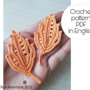 May include: Two crocheted orange leaves with a lacy design. Crochet pattern PDF in English.