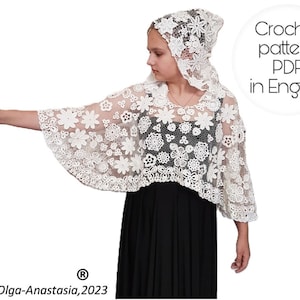 Może przedstawiać: Biały, szydełkowy zestaw szal i kaptur z kwiatowym wzorem. Szal ma rozkloszowane rękawy i szczegółowy, ażurowy wzór. Obraz zawiera tekst "Crochet pattern PDF in English" oraz informacje o prawach autorskich dla Olga-Anastasia, 2023.
