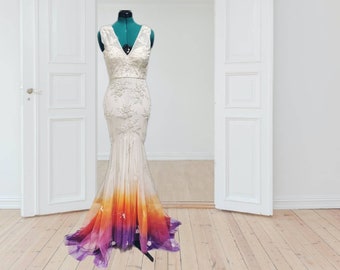 May include: A white mermaid-style wedding dress with a lace bodice and a gradient ombre skirt that transitions from white to orange, yellow, and purple.