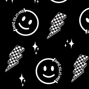 May include: Black and white seamless pattern featuring a smiling face with the text "RAD LITTLE DUDE" around it, a checkered lightning bolt, and a white star.