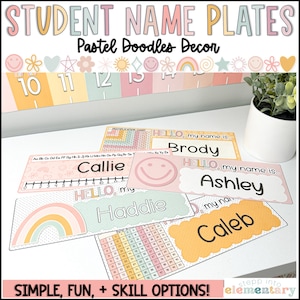 May include: Colorful student name plates with pastel rainbow, smiley face, and polka dot designs. The plates feature the text "HELLO, my name is..." followed by the student's name. The plates are designed for use in a classroom setting.