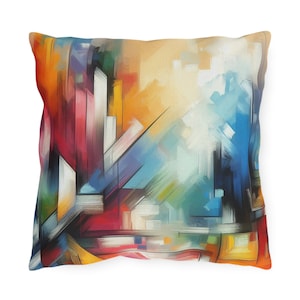 Puede incluir: Funda de cojín de arte abstracto con un diseño geométrico colorido en tonos de rojo, naranja, amarillo, azul y blanco.