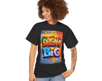 May include: A black t-shirt with a colorful graffiti design that says "DREAM BIG" on a brick wall background.
