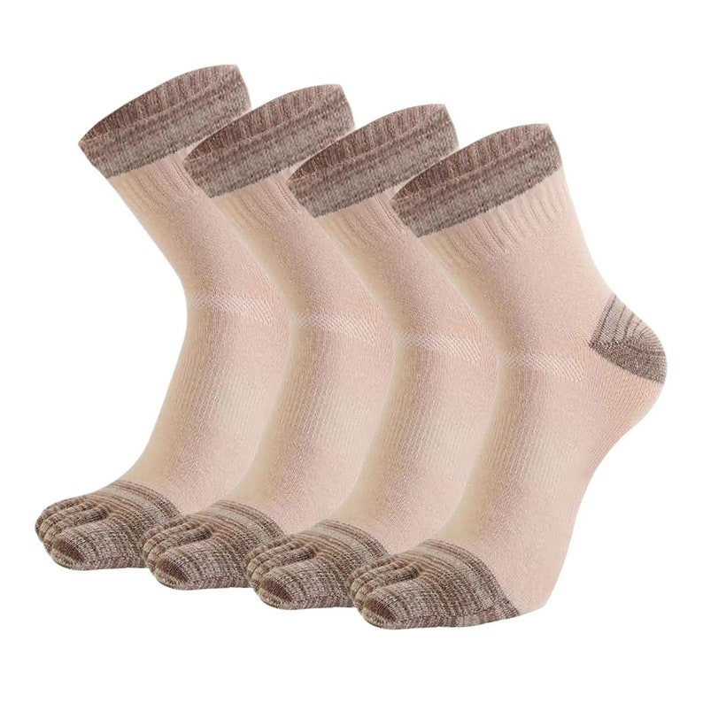 May include: Four pairs of beige toe socks with brown accents on the toe, heel, and cuff. The socks are made of a soft, ribbed material and are designed to separate the toes.