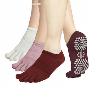 May include: Three pairs of toe socks in white, pink, and burgundy. The burgundy pair features a non-slip grip sole with the brand name "soxsense". These socks are designed with individual toe slots for enhanced comfort and grip.