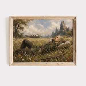 Op de afbeelding: Een ingelijste olieverfschilderijprint van een persoon met lang blond haar die in een veld met wilde bloemen ligt. De persoon draagt een donkergroene tuniek en een bruine broek. Op de achtergrond staat een groot ruimteschip in een weiland.