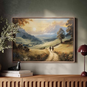 Puede incluir: Una pintura de paisaje enmarcada que representa a dos figuras caminando por un sendero a través de un valle. La pintura presenta un valle verde vibrante con colinas onduladas y una cadena montañosa en la distancia. El cielo es de un azul suave con algunas nubes. La pintura está enmarcada en un marco de madera simple.