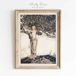 May include: A framed print depicting a woman standing in a tree laden with fruit. She is wearing a long white dress and has long blonde hair. The tree is surrounded by clouds and there are two peacocks on the ground.