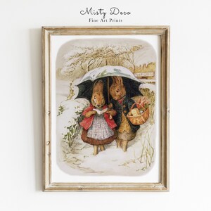 May include: A vintage illustration of two rabbits walking in the snow. The rabbit on the left is wearing a red coat and holding a book. The rabbit on the right is wearing a blue coat and carrying a basket. They are both under a green umbrella.