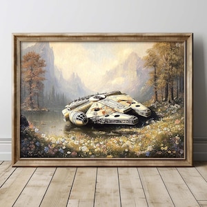Op de afbeelding: Ingelijste kunstdruk van een ruimteschip, de Millennium Falcon, rustend in een bloemenveld bij een meer. Het kunstwerk heeft een vintage, schilderachtige stijl met een landschapsachtergrond van bergen en bomen.
