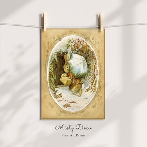 May include: A vintage illustration of a brown rabbit holding an umbrella and a basket, walking through a snowy woodland scene. The illustration is framed in a gold oval with ornate details.