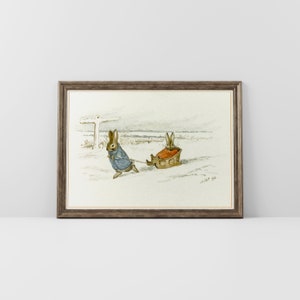 May include: A watercolor painting of two brown rabbits in a snowy landscape. One rabbit is pulling a sled with the other rabbit sitting in it. The painting is framed in a brown frame.